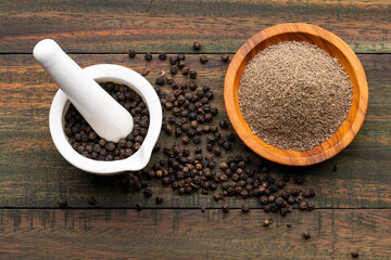 Ground black pepper flavored in a mortar and a bowl - Piper nigrum