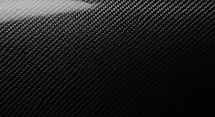 Close up of shiny black carbon fiber weave texture background