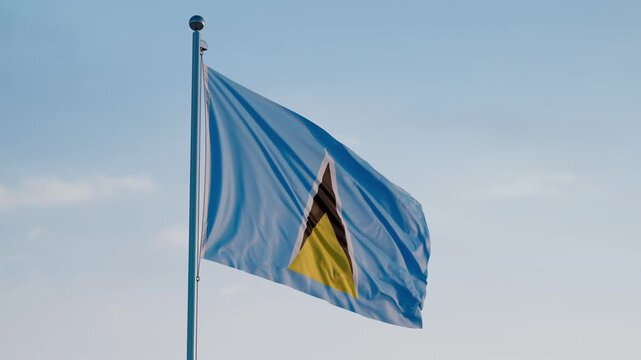 Saint Lucia, Castries: Cinematic Waving National Flag Against Blue Sky