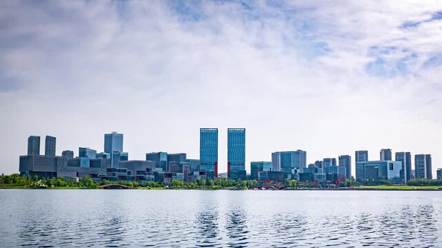A row of modern high-rise buildings parallel to the lake