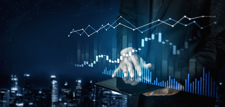 A businessman analyzes stock market trends on a tablet, surrounded by financial graphs and a cityscape at night, representing modern analytics in finance. Scalp