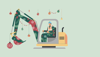 Seasonal construction worker driving a festive excavator decorated for Christmas holidays © VisualPro