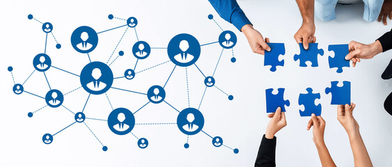 This image depicts a modern networking concept with hands holding puzzle pieces intertwined with an illustration of connections, symbolizing teamwork and collaboration. Amity