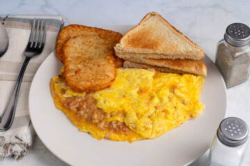 corn beef hash omelette with hash browns