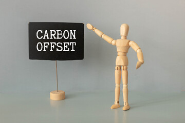 There is notebook with the word Carbon Offset.