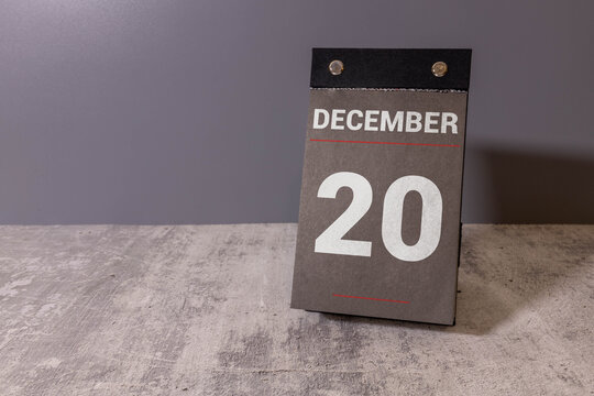 December, 20 on calendar on wooden table close-up