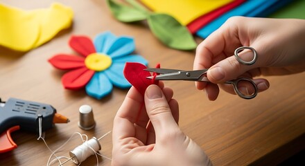 Hands Carefully Crafting Felt Flower Petals with Precision Scissors