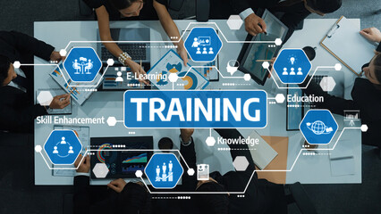 Engaging training session showcasing business professionals collaborating on skill enhancement and e-learning strategies to boost education and knowledge in a digital landscape. Amity