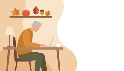 Focused senior man uses laptop in cozy autumn interior with fall decor Copy space included
