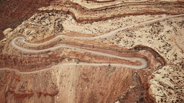 Aerial flyover of cars traveling on the Moki Dugway near Mexican Hat, UT