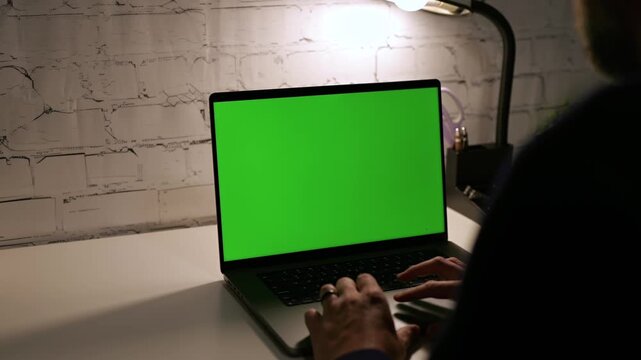 Middle Aged Man on Blank Laptop Green Screen Custom Content - Chroma Key Computer White Brick Background with White Desk