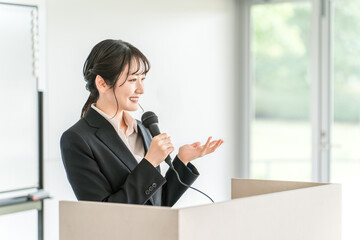 Businesswoman giving a presentation at a meeting, training session, or presentation
