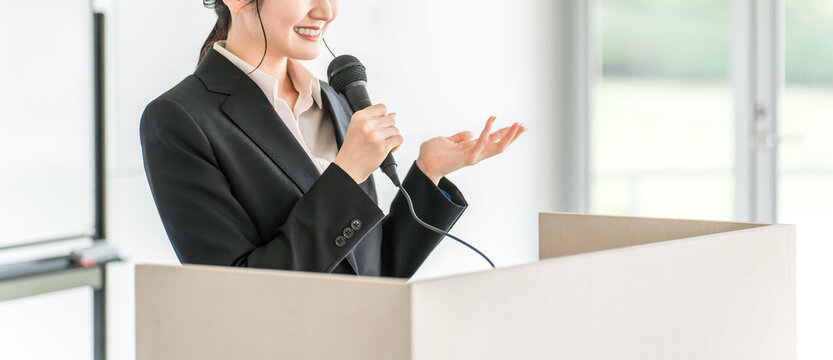 Businesswoman giving a presentation at a meeting, training session, or presentation
