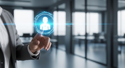 A person touching a digital interface with a human icon in a modern office environment shown clearly