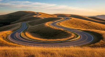 A Winding Road Ascends Through Breathtaking Golden Hills During Golden Sunrise or Sunset