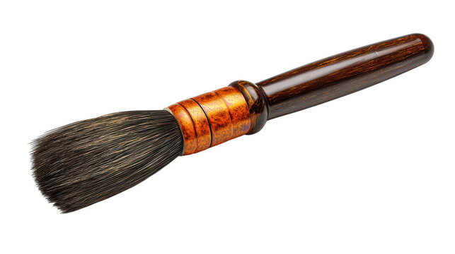 A professional paint brush with a wooden handle and copper ferrule rests on a black surface