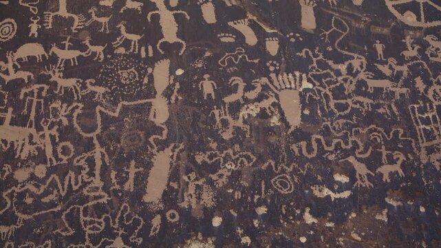 A close up panning shot of petroglyphs at Newspaper Rock near Canyon Lands National Park, Utah