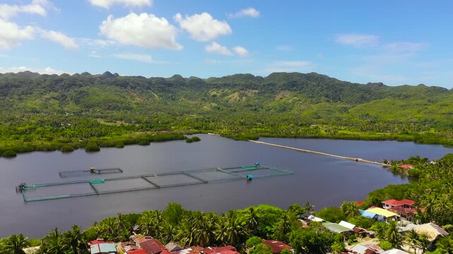 Fish farm with ponds and nets among the mountains covered with jungle.Bohol, Philippines.