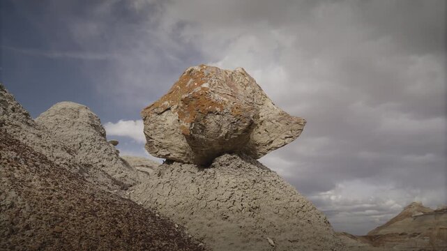 A timelapse of clouds passing by a petrified tree stump in the Bisti rock garden, near the Bisti Badlands, NM