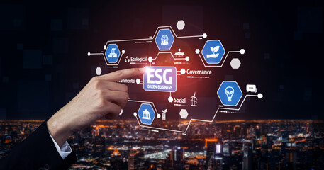A businessman interacts with digital ESG icons highlighting ecological, social, and governance elements, showcasing modern strategies for sustainable business development at night. Tessel