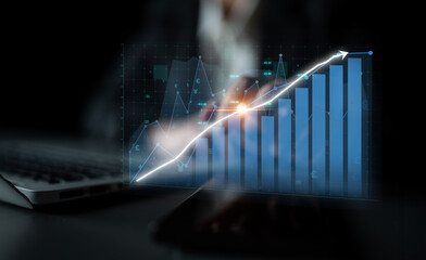 A business analyst is engaged in reviewing financial data on a digital screen within a modern office, emphasizing growth metrics and strategic insights crucial for success. Impute