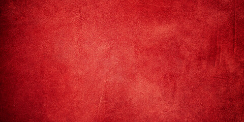 Suede leather natural red color as a background with a dark edge.