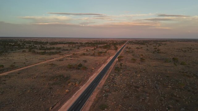 Sunset over the road in the Outback Australia