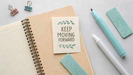 Inspiring message Keep Moving Forward on a notebook