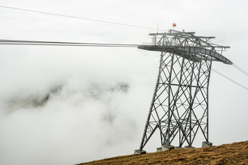 Tower Emerges From Fog Along The Eiger Express Gondola