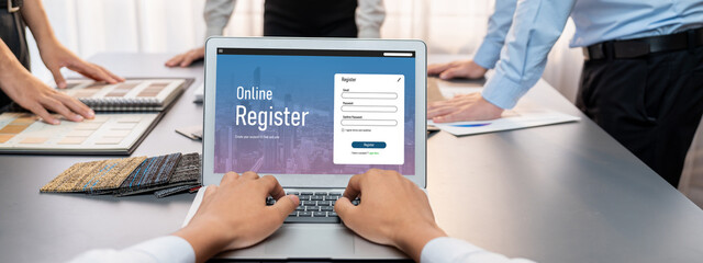 Group of interior architect designer team at table choosing various mood board samples with architecture software on laptop screen. Modern renovation and interior material selection concept. Insight