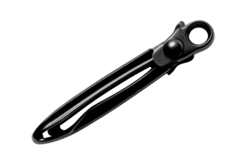 Black, curved, metal object with a hole on black backdrop