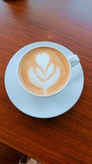 A cup of cappucinno with beautiful cream latte art
