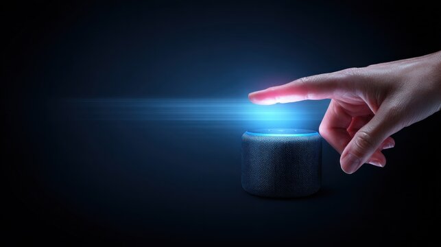 A hand pointing at a smart speaker with a glowing blue light on a dark background.
