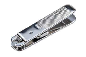 Shiny silver nail clipper with textured grip on black