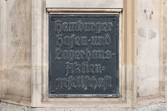 Old sign of the former Hamburger Hafen- und Lagerhaus-Aktiengesellschaft at a building exterior. The company is now known as Hamburger Hafen und Logistik AG (HHLA) and is a big logistics corporation.
