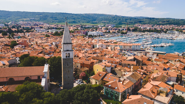 Church tower above seaside town aerial view