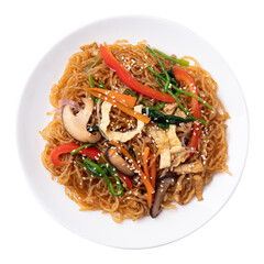 Japchae, Korean stir fried glass noodles with vegetables, pork, soy sauce and sesame oil on plate, Top view	