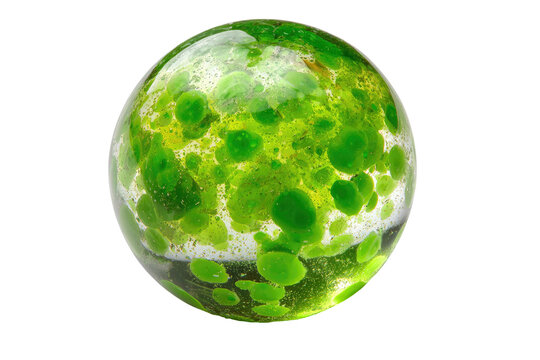 Green-speckled glass orb on black background