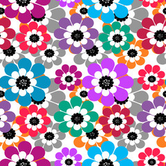 Multicolored paper cut flowers on a white background 