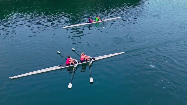 Beautiful Aerial Footage Capturing A Group Of Women And Female Athletes Rowing Boats On Calm Ocean Waters During Golden Morning Light In Halifax.Cinematic Drone Shot Of Rowers Training At Sunrise 