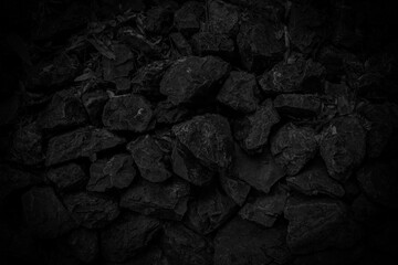 Dark black stone fence wall on background