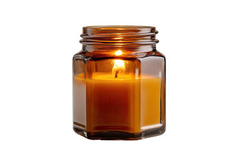 Lit candle in glass jar, amber wax and flame