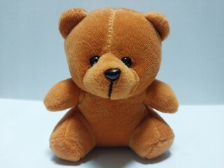 A cute brown teddy bear plush toy photographed on a clean background, ideal for kid-themed content, product display, and online store visuals.