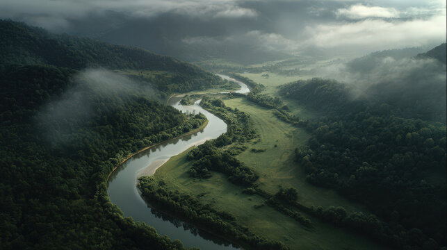 aerial view of a misty valley with mountains and clouds - Powered by Adobe