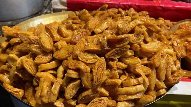 Mini khaja prepared in a street shop in Kolkata during winter