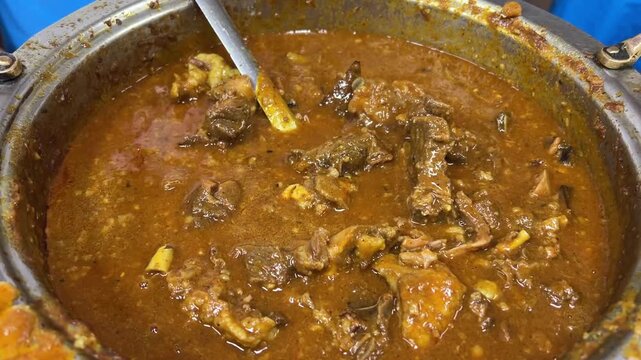 Bengali-styled mutton kossa served in an Indian wedding