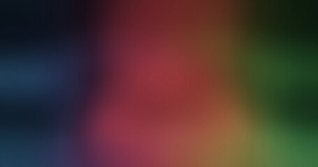 Smooth colorful gradient abstract background with transitioning hues of dark blue, red, orange, and green, creating a blurry and vibrant wallpaper effect.