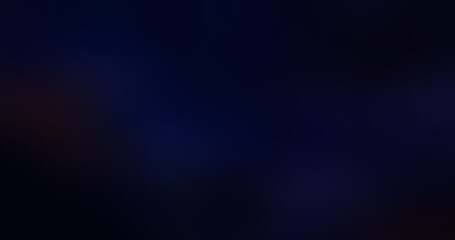 Abstract dark blue and black gradient background with subtle out-of-focus light blurs, creating a mysterious, atmospheric, and elegant wallpaper texture