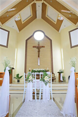 Bright Christian Church Altar and Aisle Decorated for Wedding Ceremony