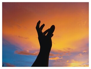 silhouette of the sun in hands